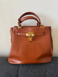 Hermès Kelly “H Perforated” Leather Bag