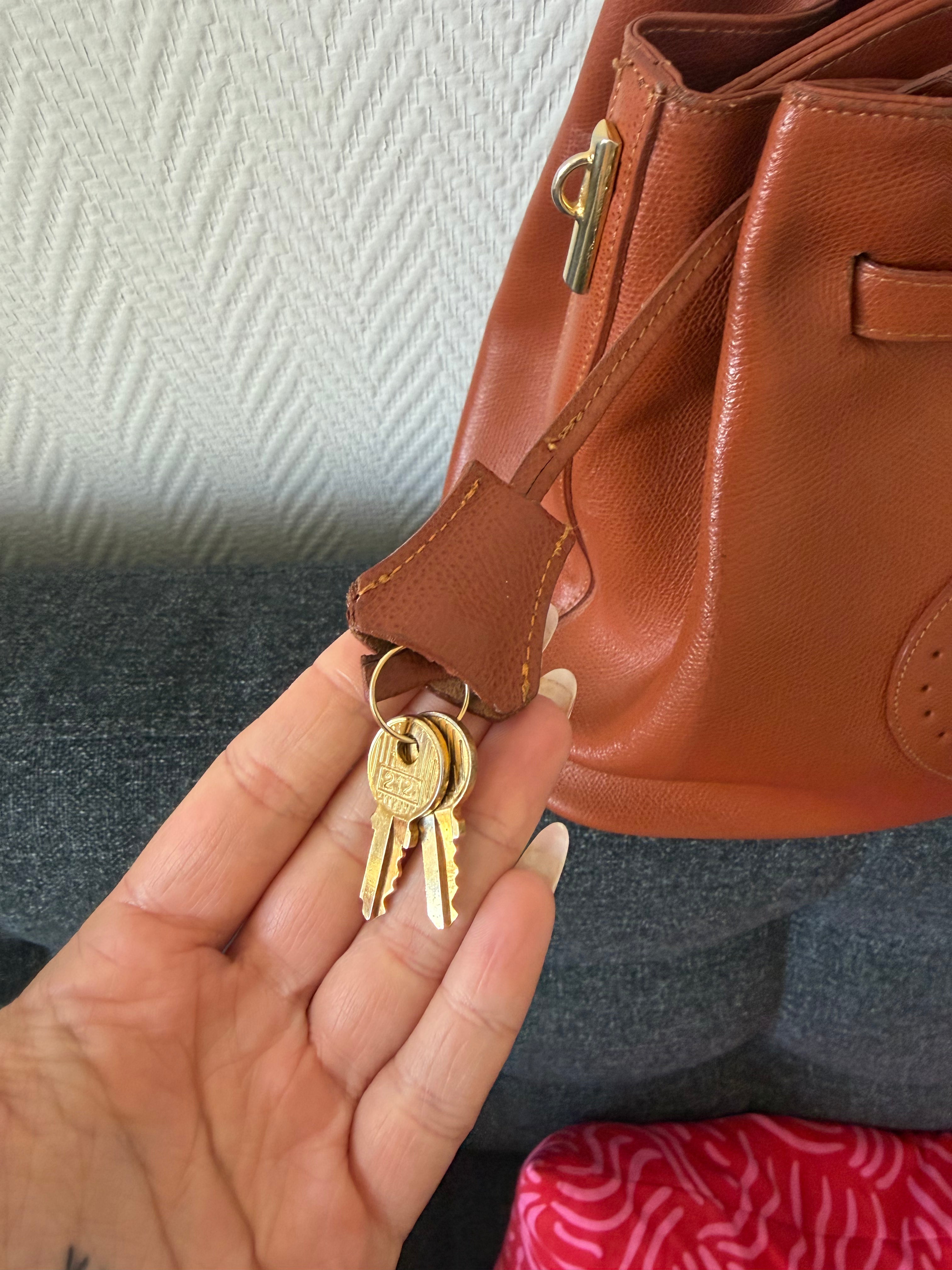 Hermès Kelly “H Perforated” Leather Bag